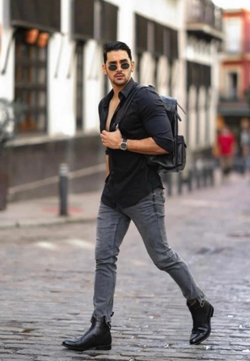 Black shirt paired with grey jeans