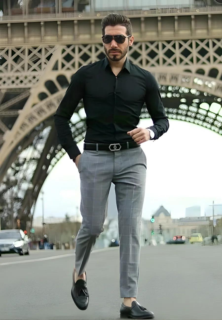 Man in black shirt and checkered trousers.