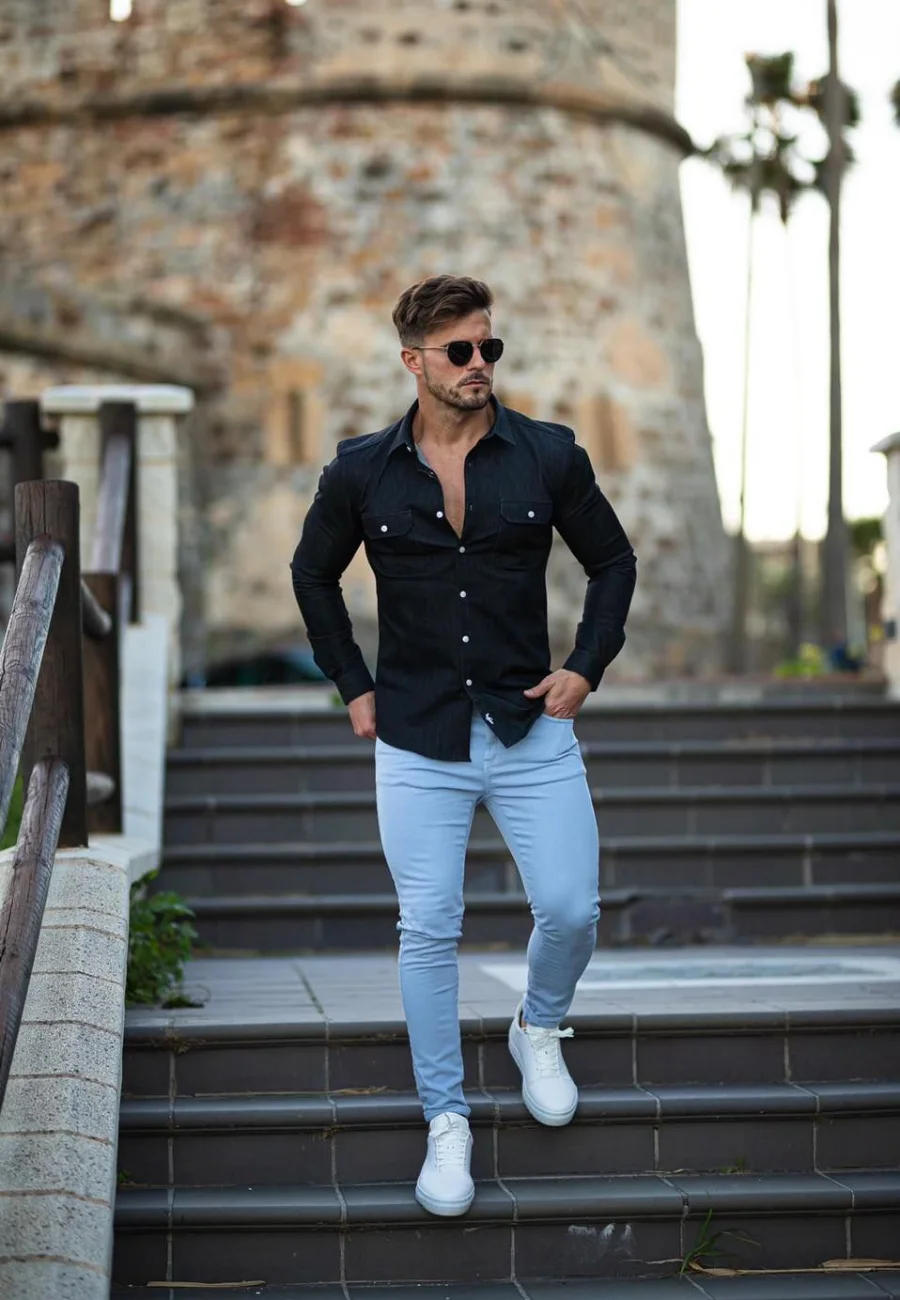 Man wearing black shirt light jeans