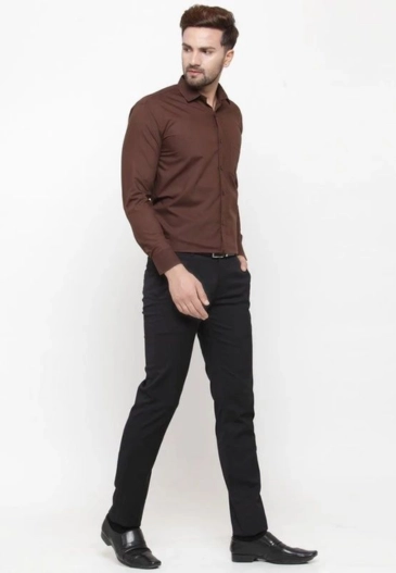 Man wearing brown black outfit