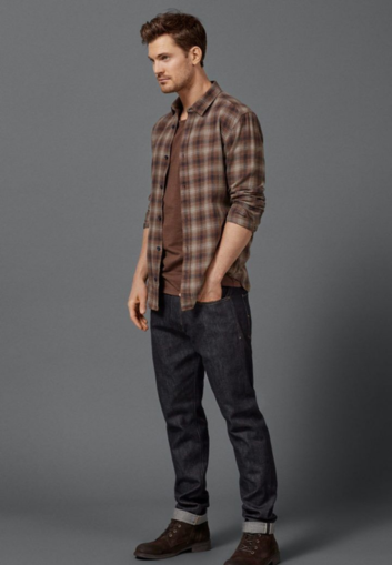 Man in plaid shirt posing