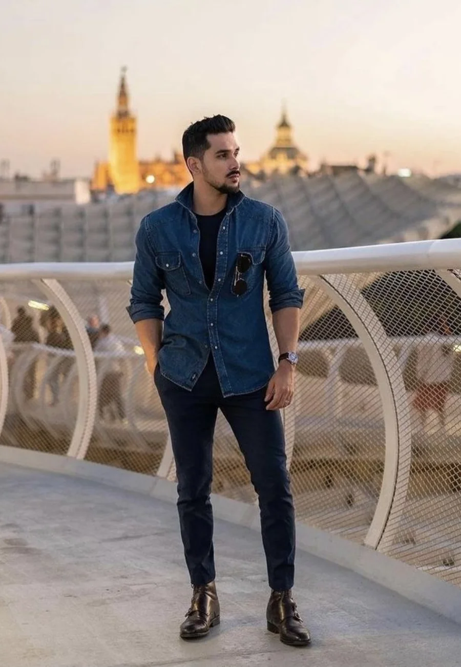 Man wearing denim shirt navy trousers