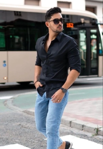 Man in black shirt walking