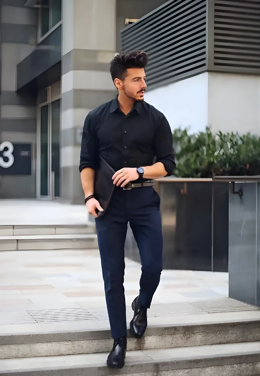 Man in black shirt and navy trousers.