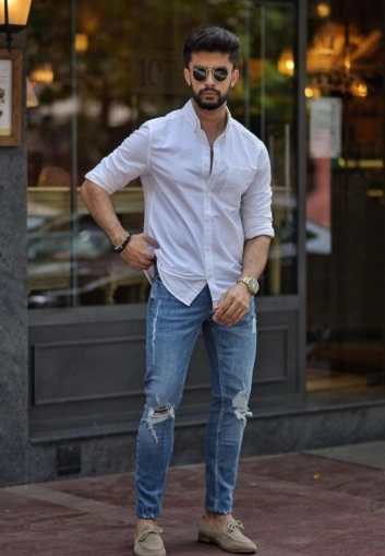 Man in white shirt walking