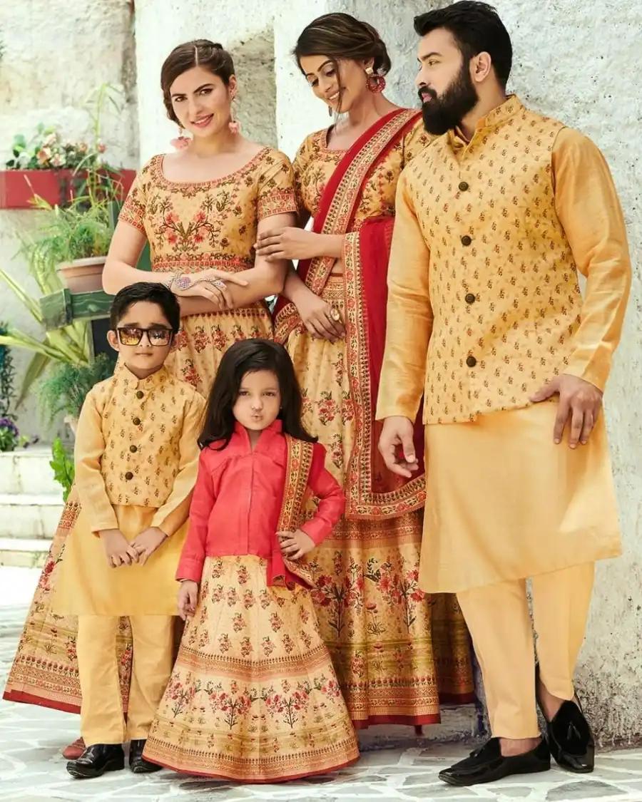 Family in traditional matching outfits for event