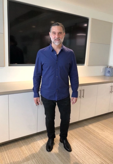 Blue shirt with black pants