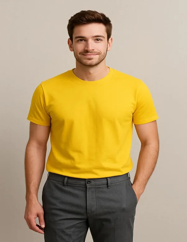 Man wearing yellow t-shirt with grey trousers
