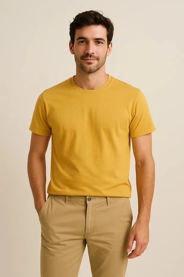 Man wearing mustard t-shirt and beige trousers