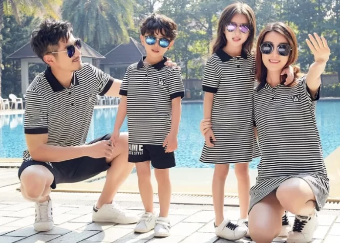 Matching Family Outfits striped polos by poolside.