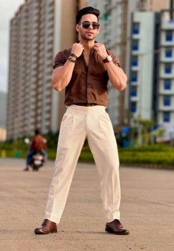Man wearing brown cream outfit