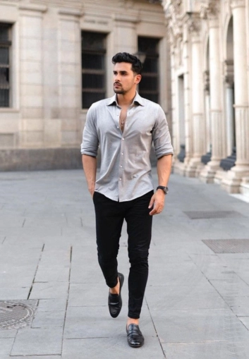 Stylish man in grey shirt, black pants