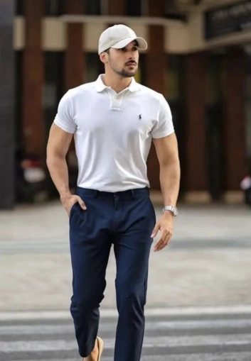 Stylish man in white polo and navy pants